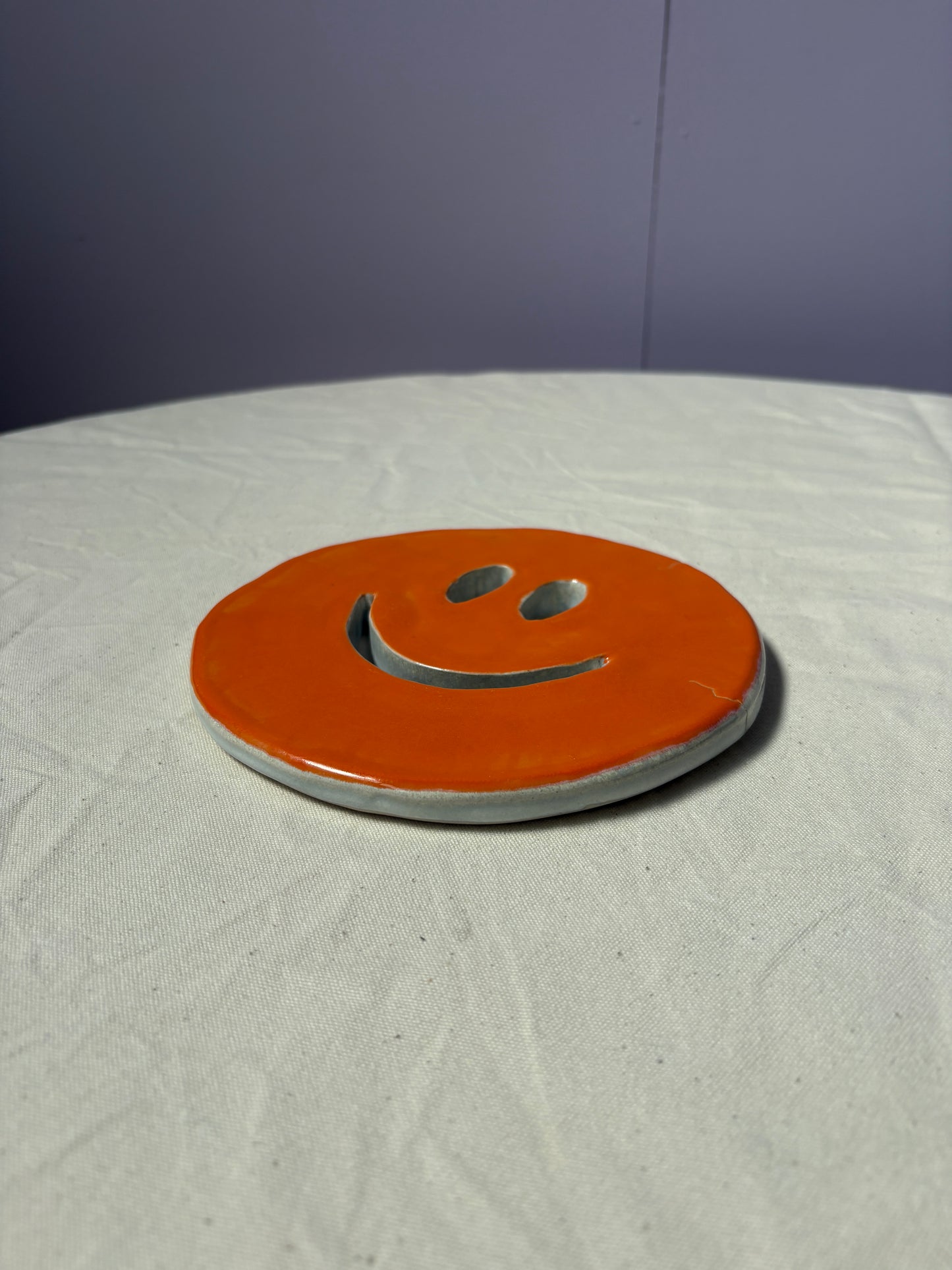 SALE Smiley onderzetter oranje wit