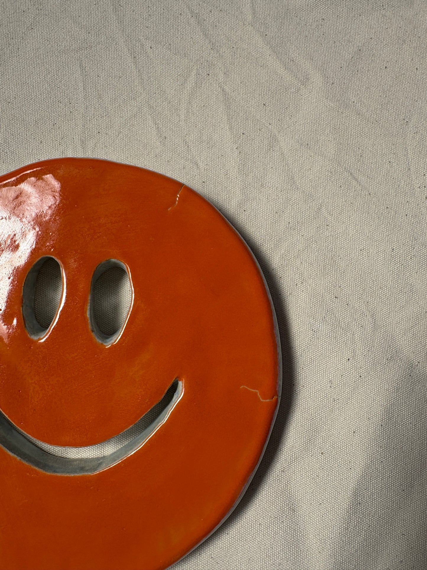 SALE Smiley onderzetter oranje wit
